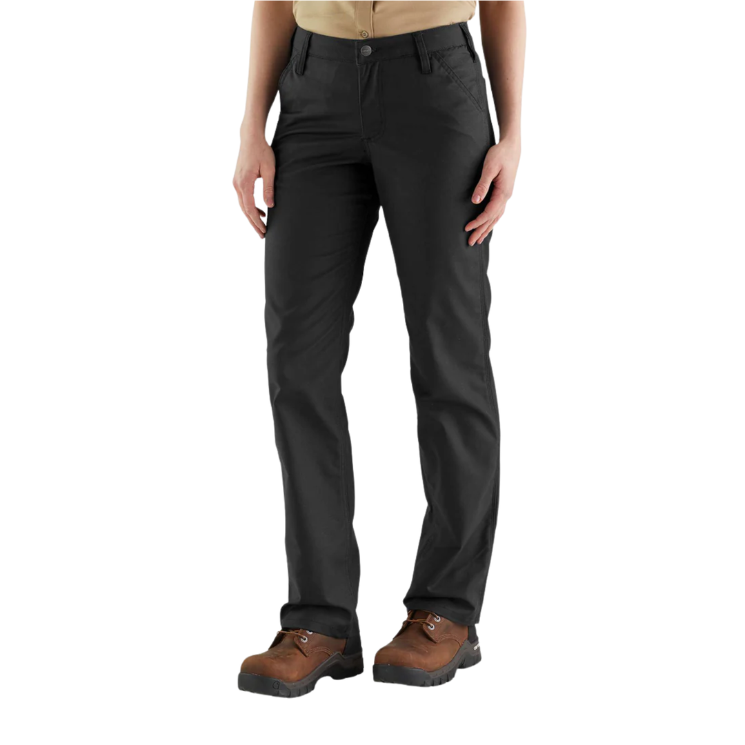 Person wearing black pants and brown boots on a white background