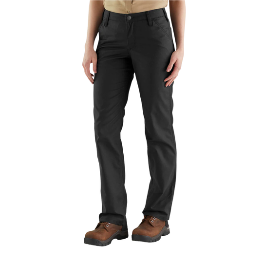 Person wearing black pants and brown boots on a white background