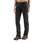 Person wearing black pants and brown boots on a white background