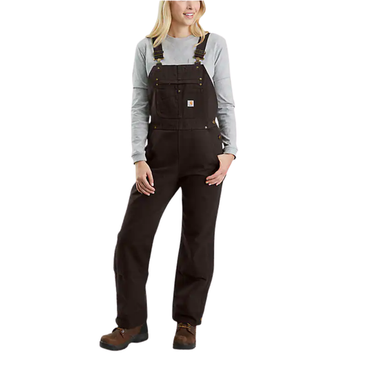 Person wearing dark brown overalls on a white background