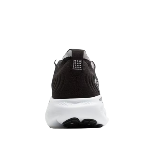 Black and white sneaker on a light gray background