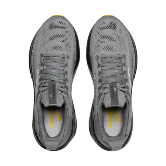 Pair of gray running shoes with visible brand logo on a white background