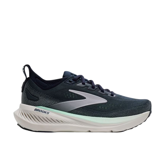 Navy running shoe with white sole on a white background