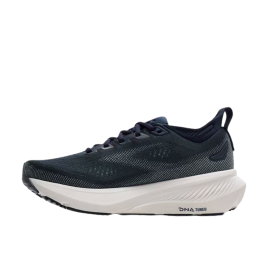 Navy running shoe with white sole on a white background