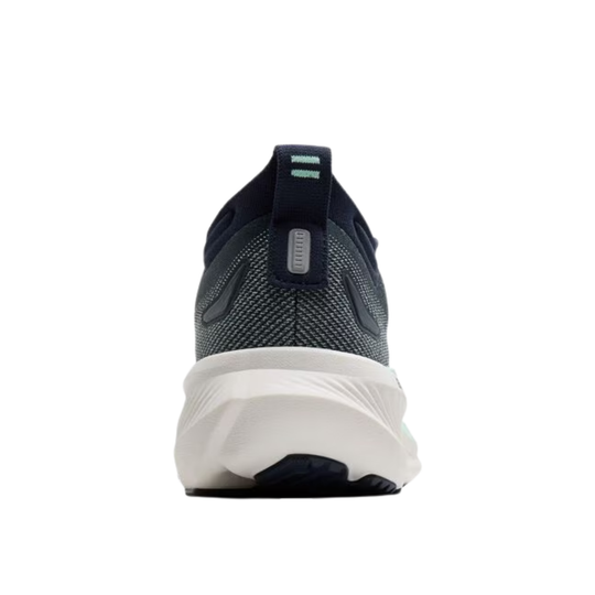 Navy running shoe with white sole on a white background