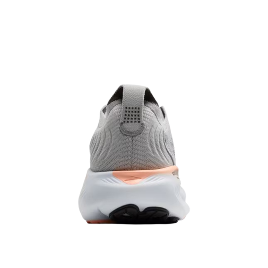 Gray and white sneaker with a pink sole on a white background
