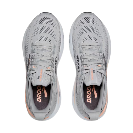 Pair of gray running shoes with 'Brooks' branding on a white background