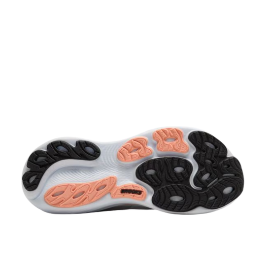 Close-up of a shoe sole with orange and black patterns on a white background