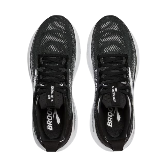 Black running shoes with visible branding on a white background