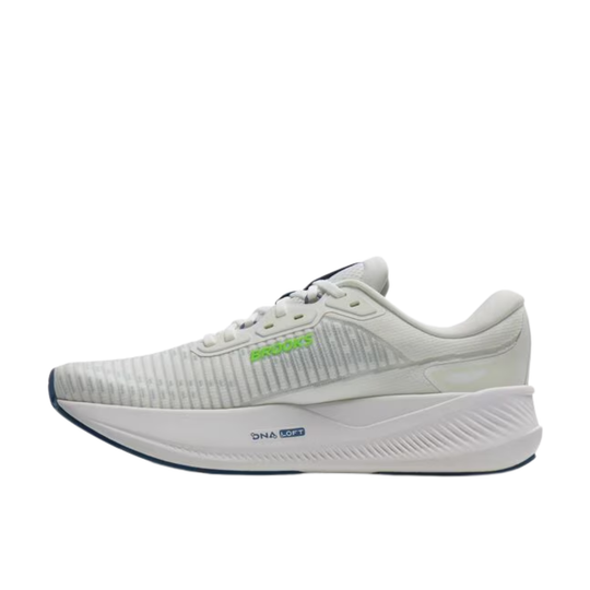White running shoe with green accents on a white background