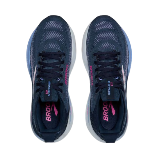 Pair of blue running shoes with pink branding on a white background