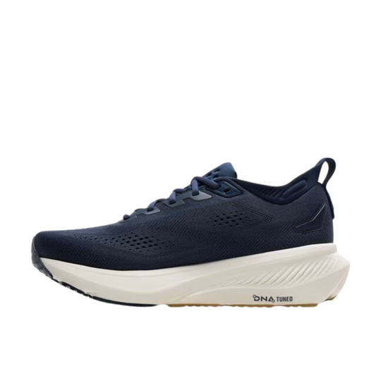 Navy running shoe with white sole on a white background