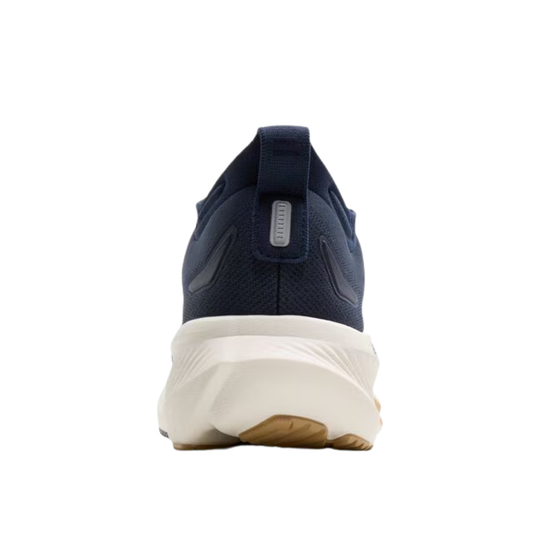 Navy shoe with a white sole on a white background