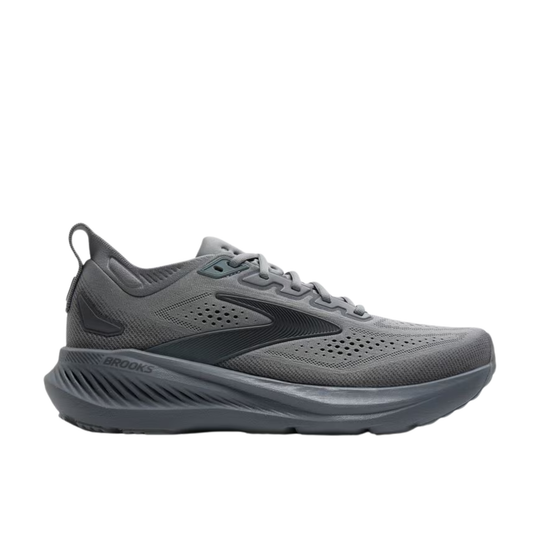 gray athletic shoe with red sole on a white background