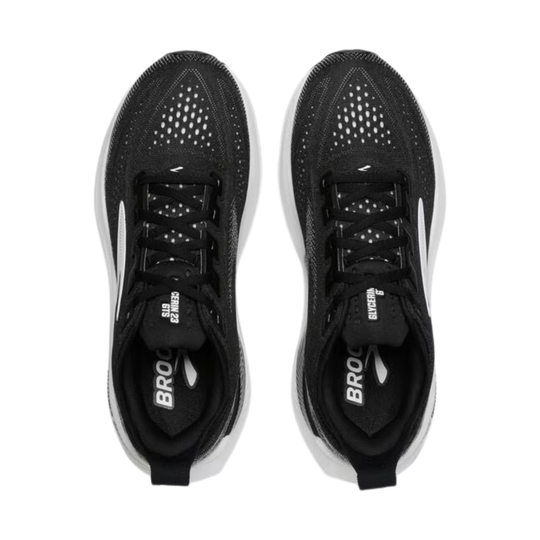 Black running shoes with white sole on a white background
