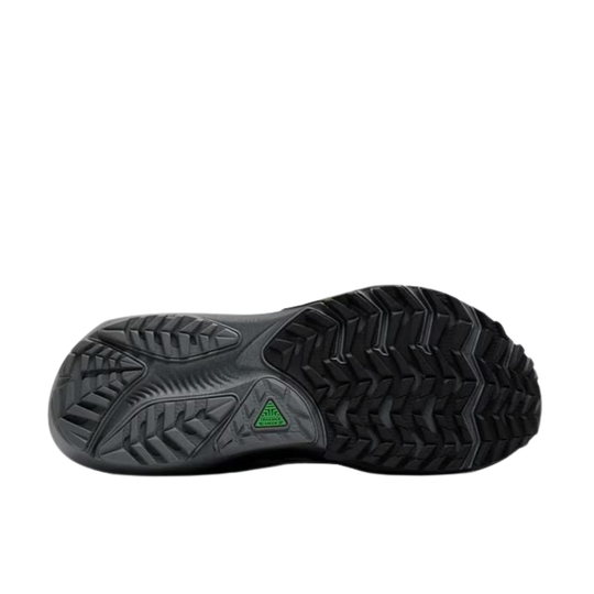 Black shoe sole with a green triangle logo on a white background