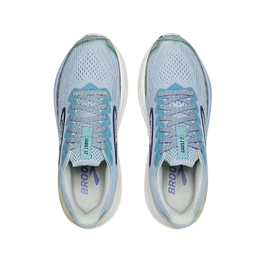 Pair of light blue running shoes with white soles on a white background