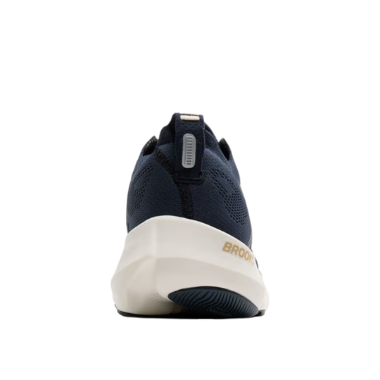 Navy blue sneaker with white sole on a white background