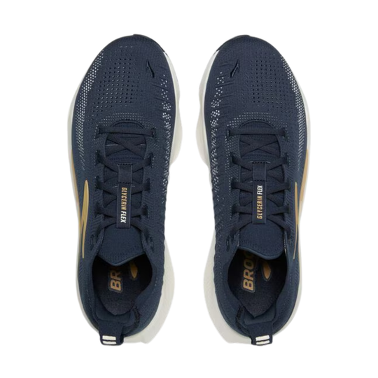 Pair of navy blue athletic shoes with gold accents on a white background