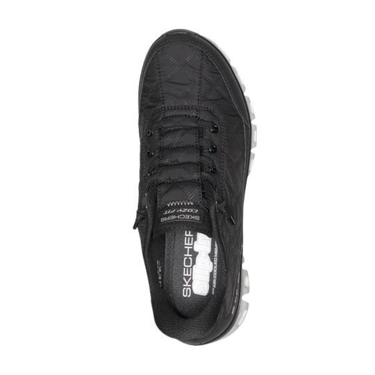 Black sneaker with visible brand logo on a white background