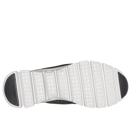 Close-up of a shoe sole with white tread pattern on a white background