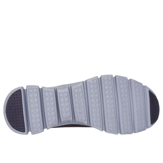 Close-up of a shoe sole with tread pattern on a white background