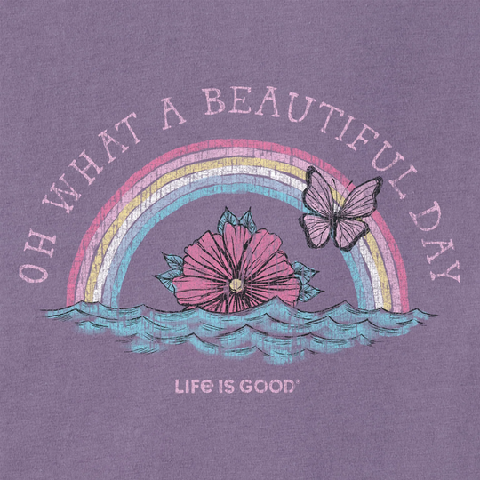 Purple T-shirt with a pastel rainbow, flower, butterfly, and "Life is Good" text.
