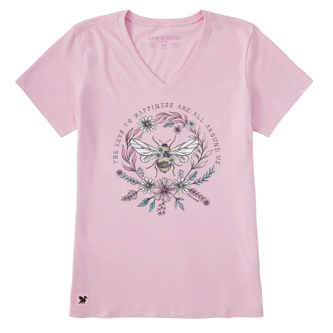 Pink t-shirt with a bee and floral design on a white background