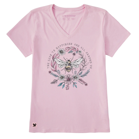 Pink t-shirt with a bee and floral design on a white background