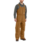 Man wearing brown bib overalls on a white background