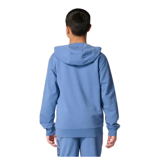 Person wearing a blue tracksuit on a white background