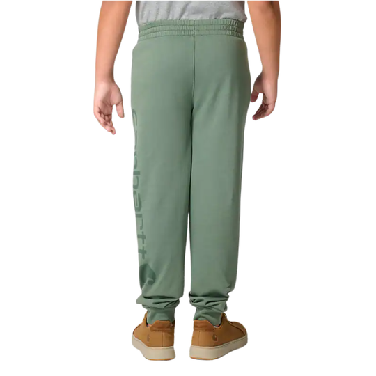 Green sweatpants worn by a person on a white background