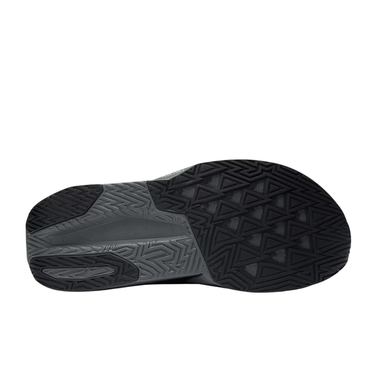 Black sandal sole with textured pattern on a white background