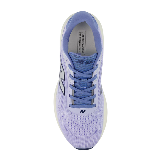 Light lavender and blue running shoe seen from above with laced tongue and New Balance logo