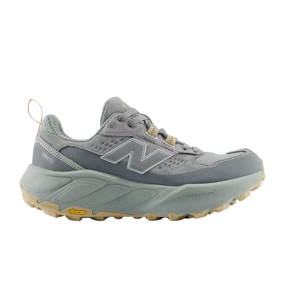 Gray trail running shoe in side view with mesh upper, thick sole, and tan outsole