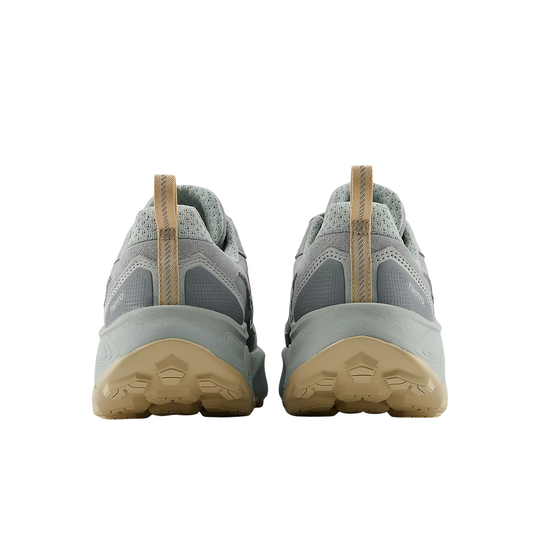 Pair of gray sneakers with beige soles on a white background