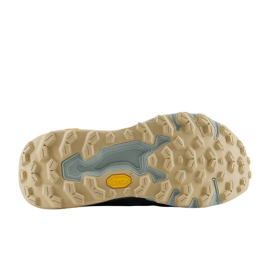 Close-up of a shoe sole with textured pattern and yellow accent on a white background