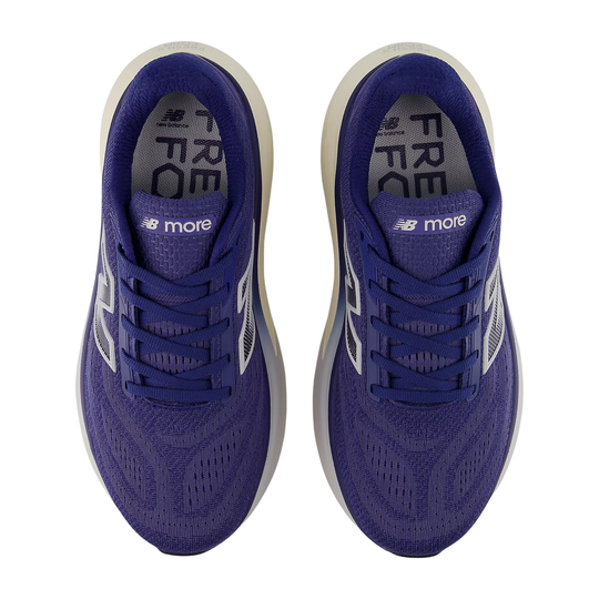 Pair of blue running shoes with white soles on a white background
