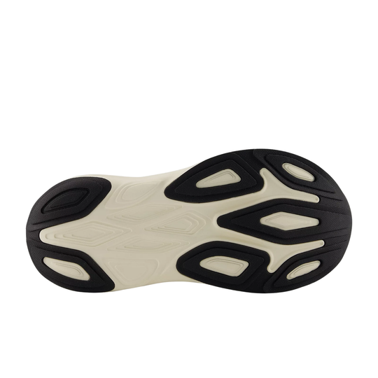 Close-up of a shoe sole with a black and beige pattern on a white background