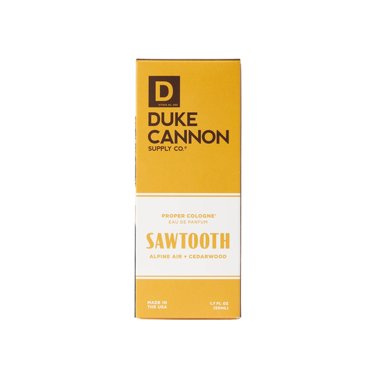 Yellow Duke Cannon Supply Co. cologne box with white lower panel and visible Sawtooth text