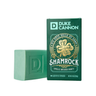 Green soap bar and Duke Cannon Shamrock soap packaging on a white background