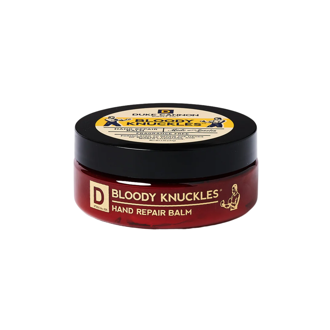 Red hand repair balm jar with a black lid on a white background