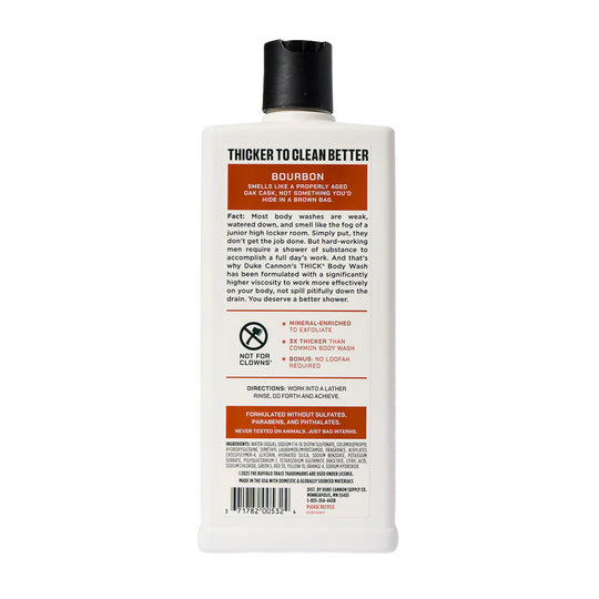 Back of white body wash bottle with black cap and orange label panels