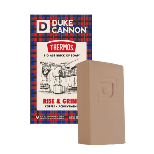 Beige soap bar beside Duke Cannon Thermos packaging on a white background