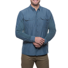 Man wearing a blue button-up shirt on a white background