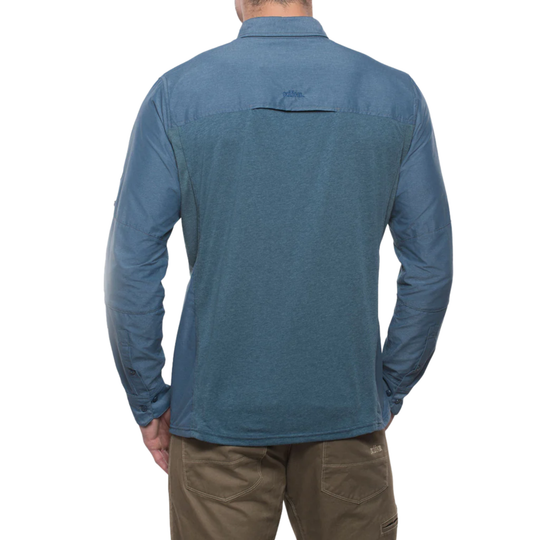 Blue long-sleeve shirt worn by a person on a white background