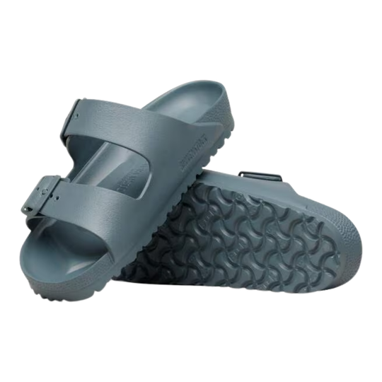 Gray sandal with a textured sole on a white background