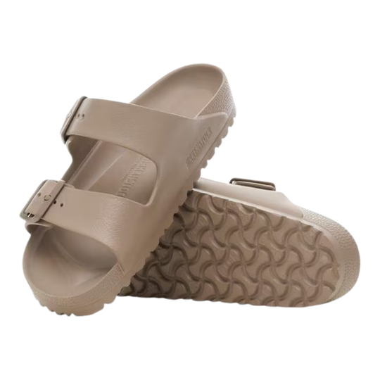 Pair of beige sandals on a white background