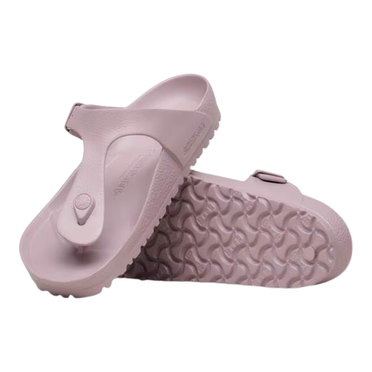 Pair of purple sandals on a white background