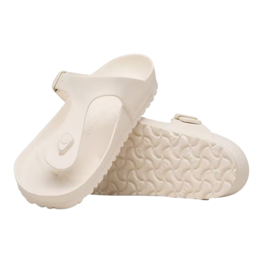 Pair of beige sandals on a white background